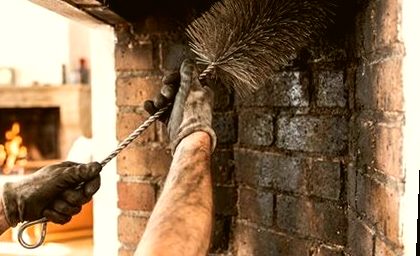 Detail dusting inside a firebox ahead of brick repair